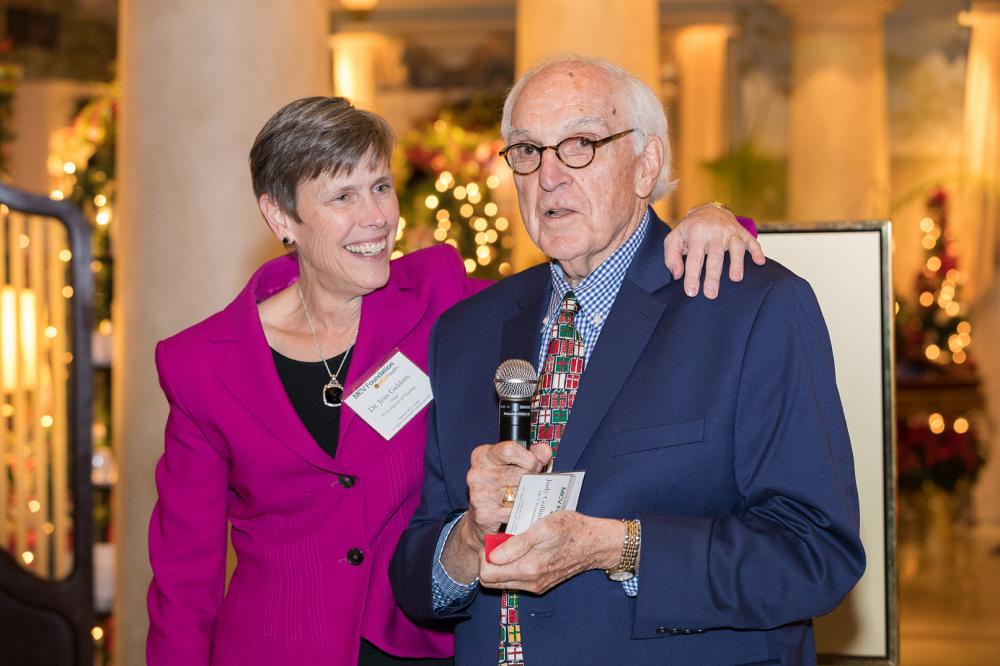 Dean Giddens with MCV Foundation board member Joe Teefey as he announces an impromtu fundraising challenge to benefit the Clinical Scholars Program at the foundation’s December board meeting reception.