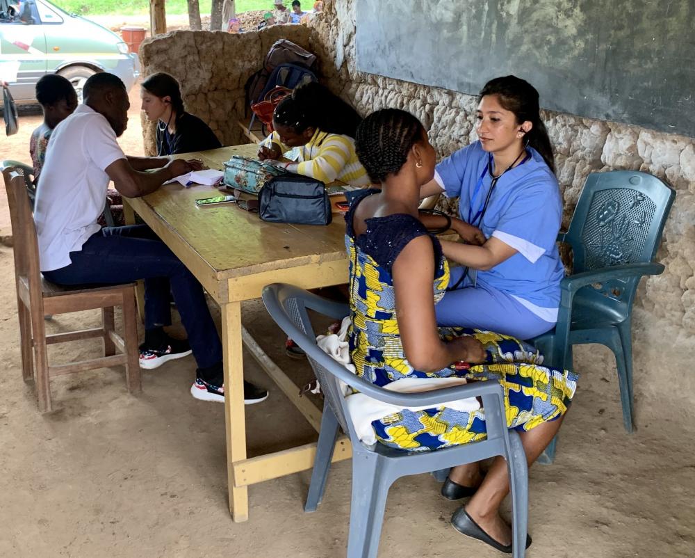 student taking blood pressure in ghana