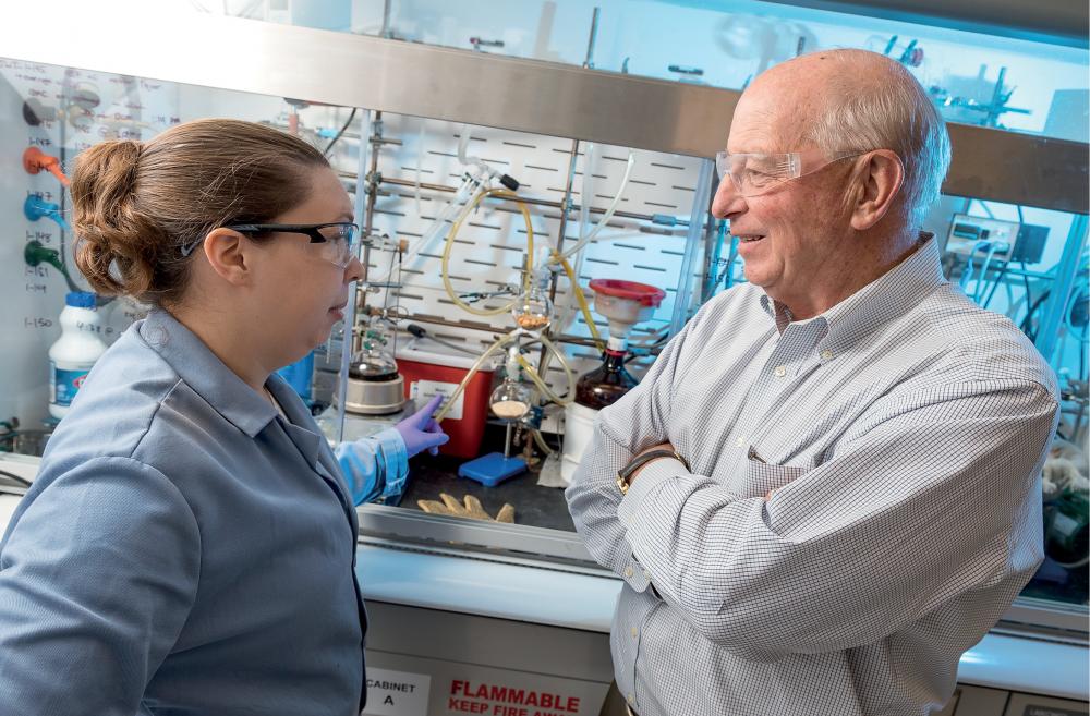 Cheryl Peck, Ph.D., a postdoctoral research associate at the Medicines for All Institute, consults with Frank Gupton, Ph.D., at their lab in Richmond. Photo: Kevin Schindler