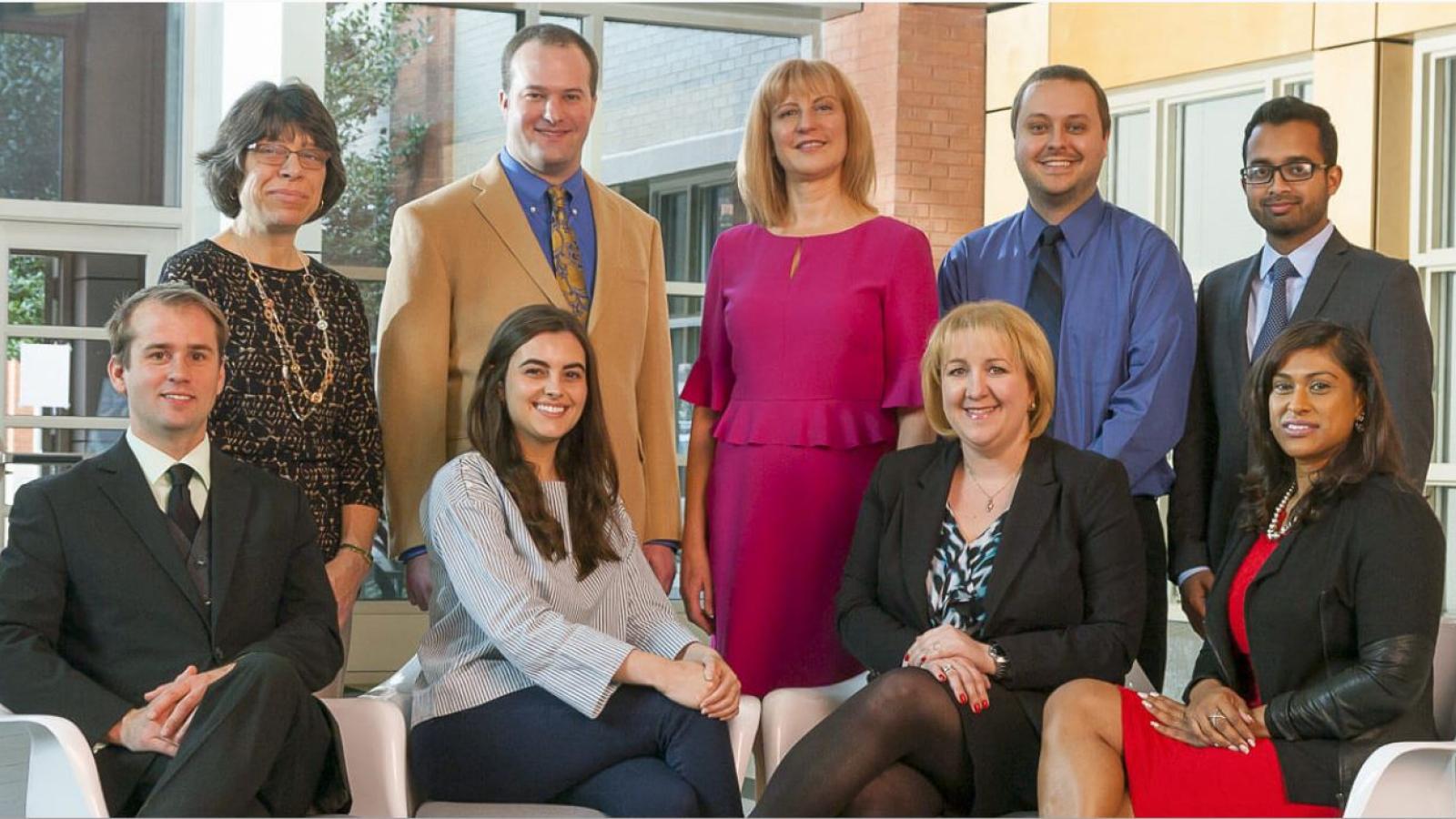The VCU Innovation Gateway team poses in the atrium of the Biotech One building on the MCV Campus. (Back row, L to R) Ann Boelzner, accountant; Michael Mancini, Ph.D., manager of business development; Ivelina Metcheva, Ph.D., executive director; Tyler Ferro, licensing liason; and Afsar Q. Mir, licensing associate. (Front row, L to R) Brent Fagg, licensing associate; Livia Horton, intellectual property administrator; Magdalina Morgan, Ph.D., licensing associate; and Zena Singh, office manager.