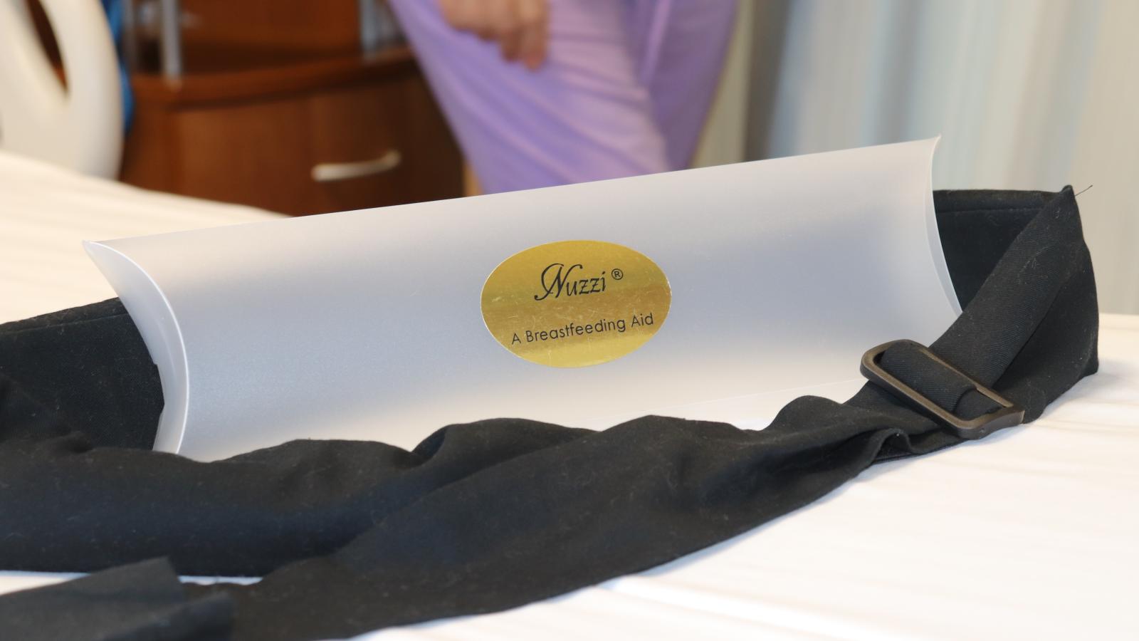The Nuzzi sits on display with its packaging. After a clinical trial that will take about six months and likely show increased duration, comfort and overall success among participants who are breastfeeding using the device, it will be ready for public use.