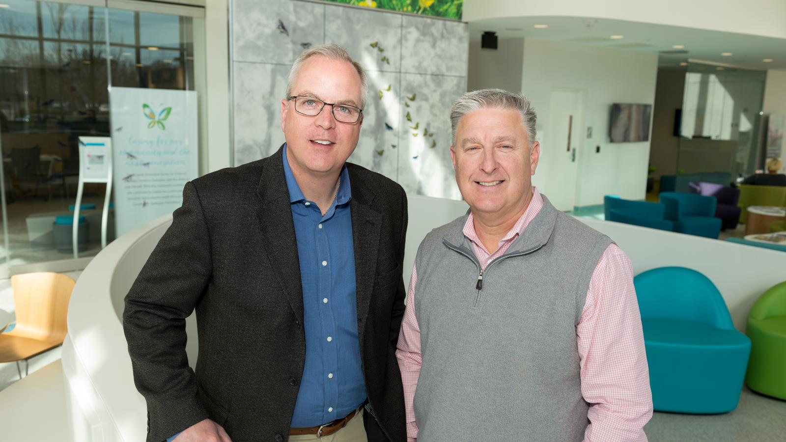 Since the facility opened in 2018, Keith Middleton and Rich Reinecke have supported VCU Health's Virginia Treatment Center for Children through fundraising and outreach at their business and beyond. here they stand in the atrium of the facility