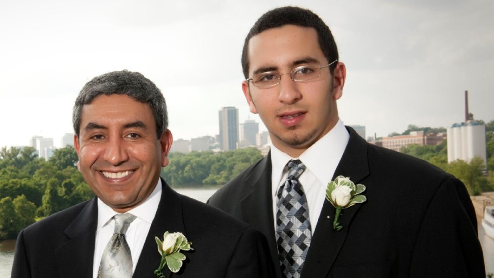 Omar Abubaker, D.M.D., Ph.D., with his son Adam