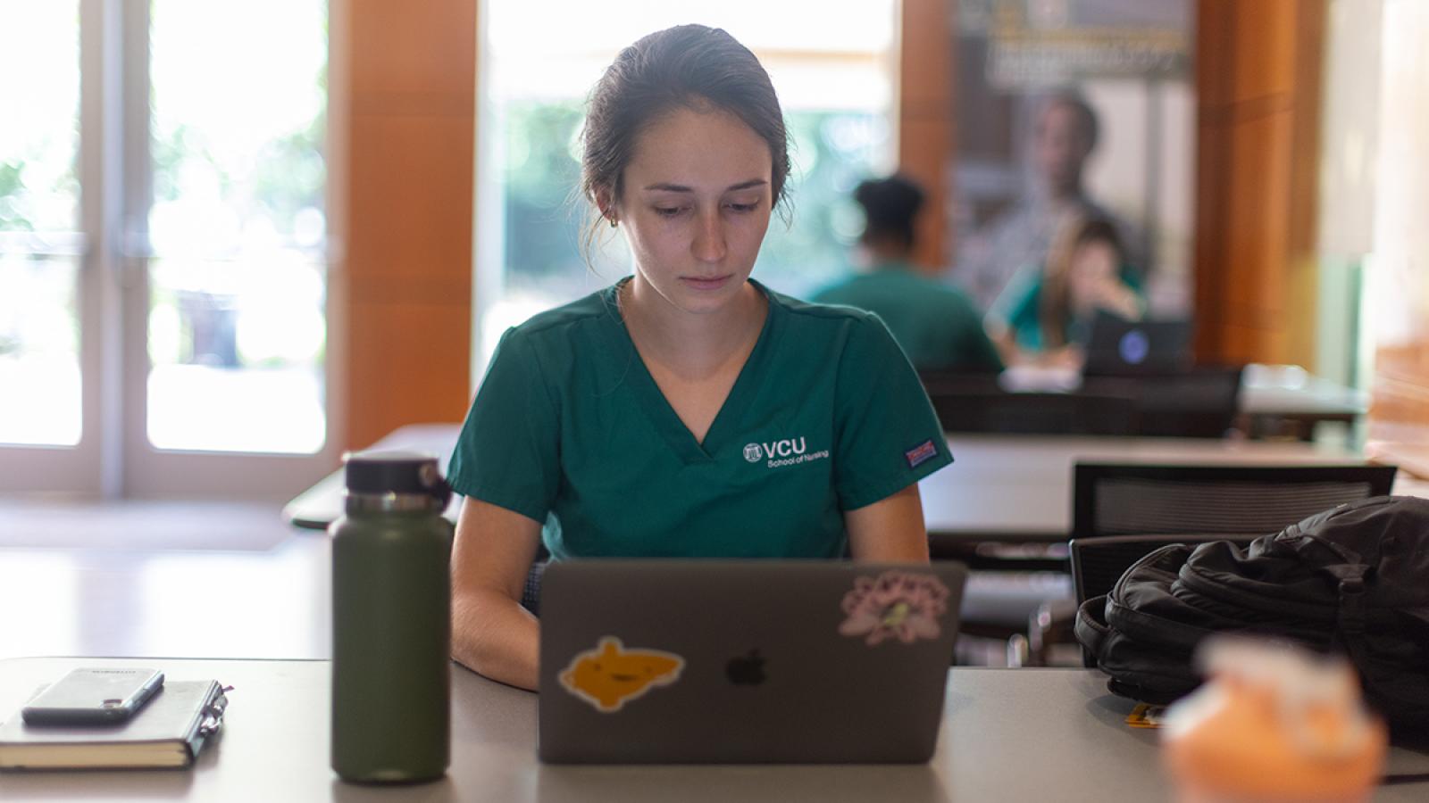 Student studying in common area